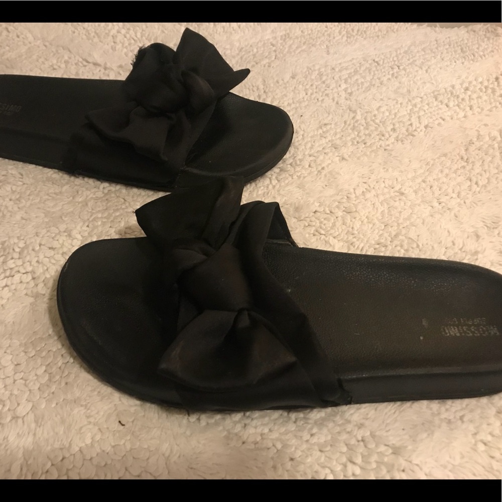 Black bow slip ons